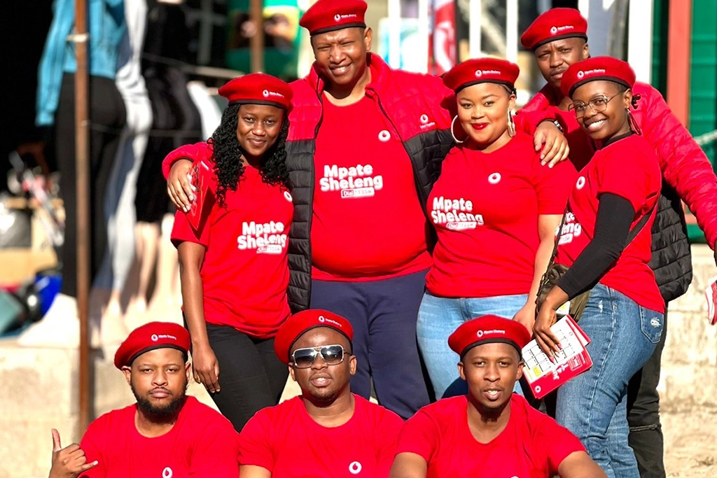 Vodacom staff on the ground interacting with customers.