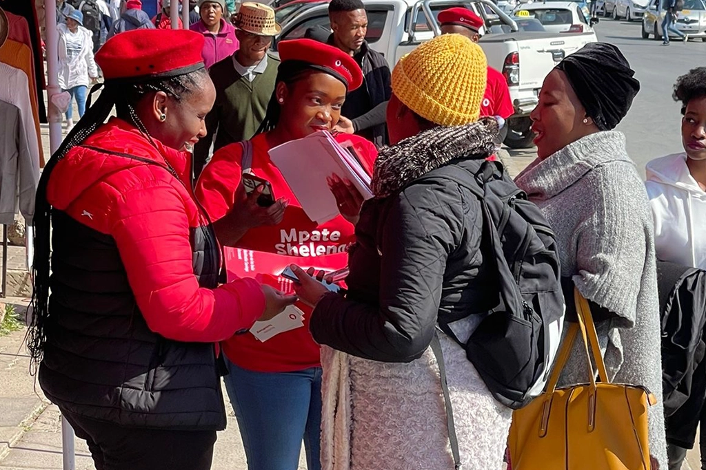 Vodacom staff on the ground interacting with customers.
